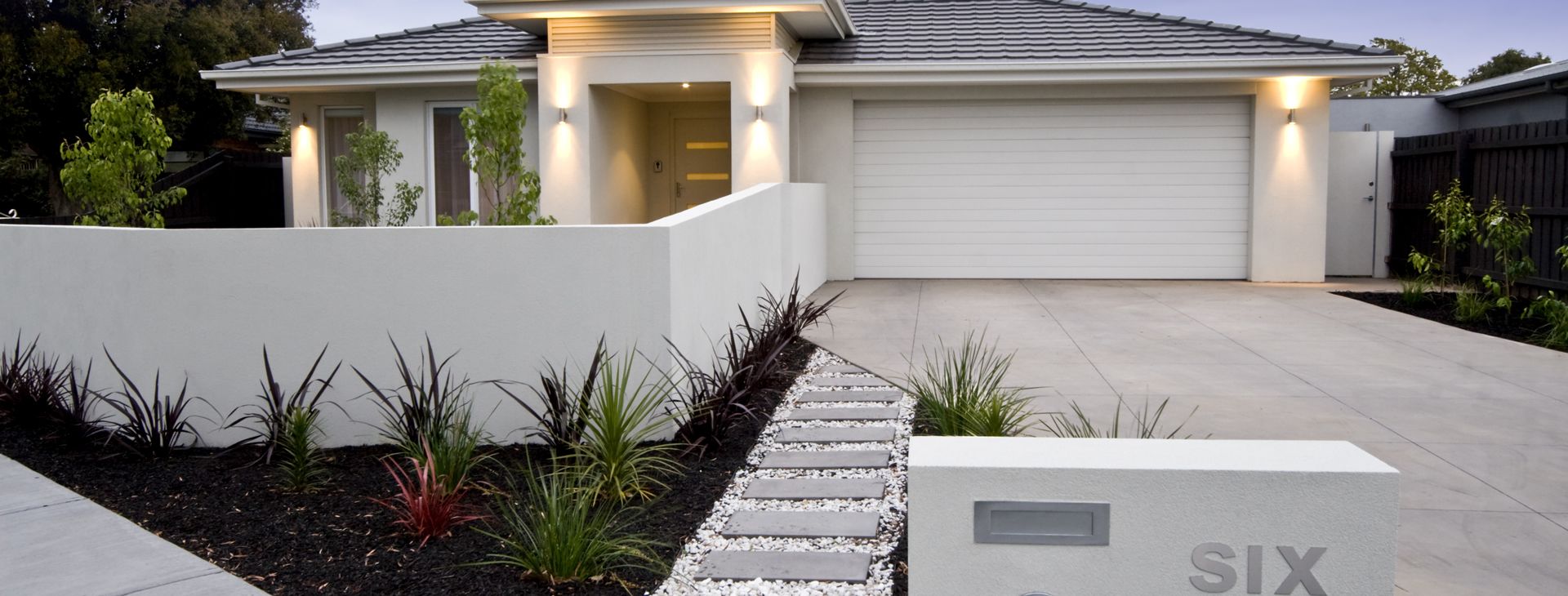 Rendered front fence and planter beds outside a new home